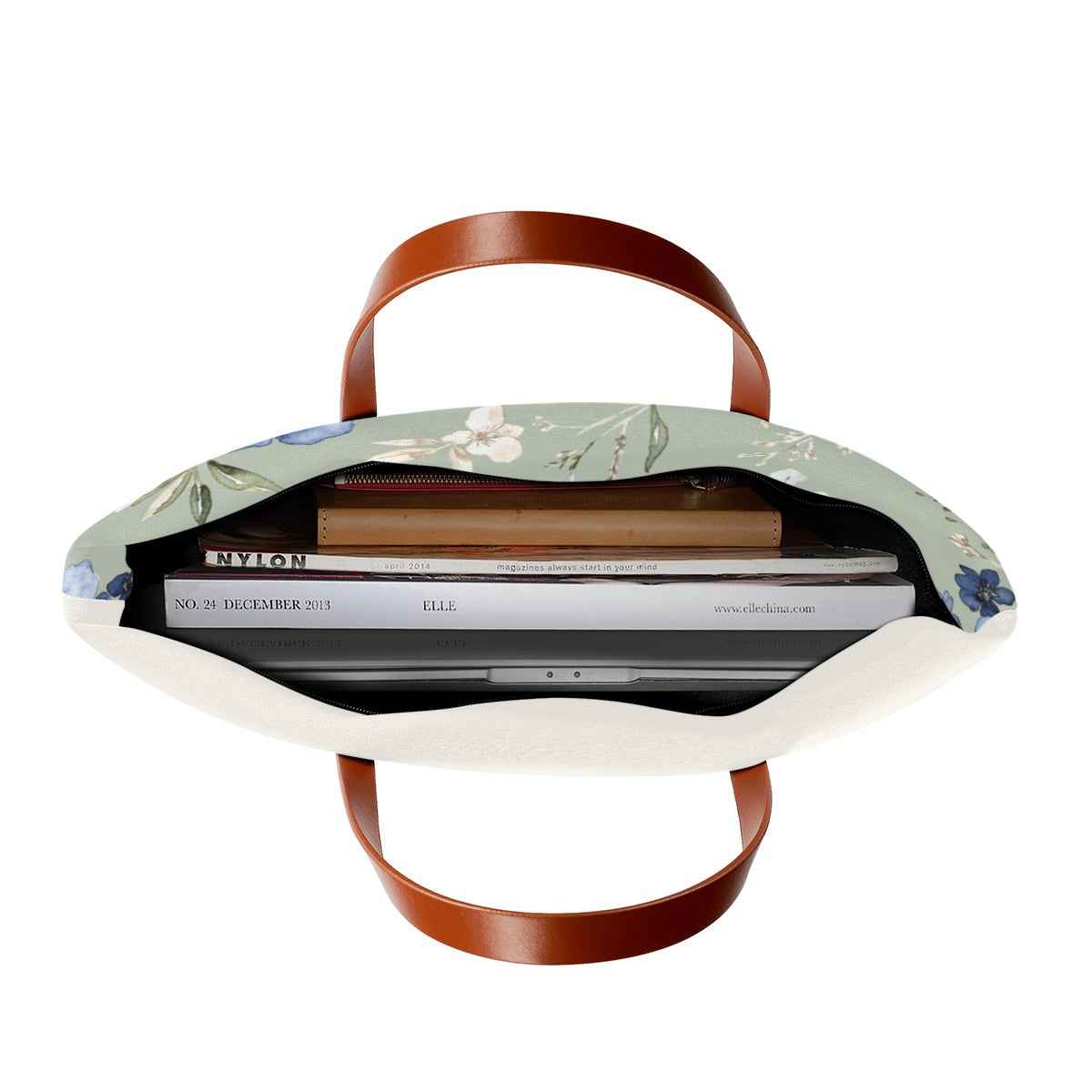 Floral fabric beach tote with brown leather-look handles, open-top view