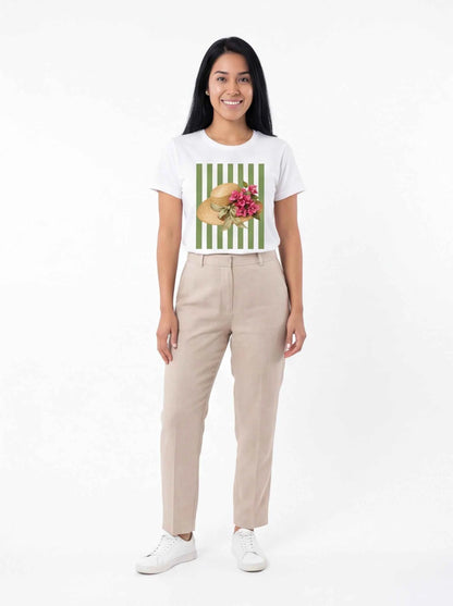 White graphic T-shirt with straw hat and pink floral print on green stripes