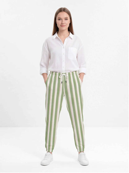Green and white striped cotton jogger pants with drawstring waist and tapered cuffs