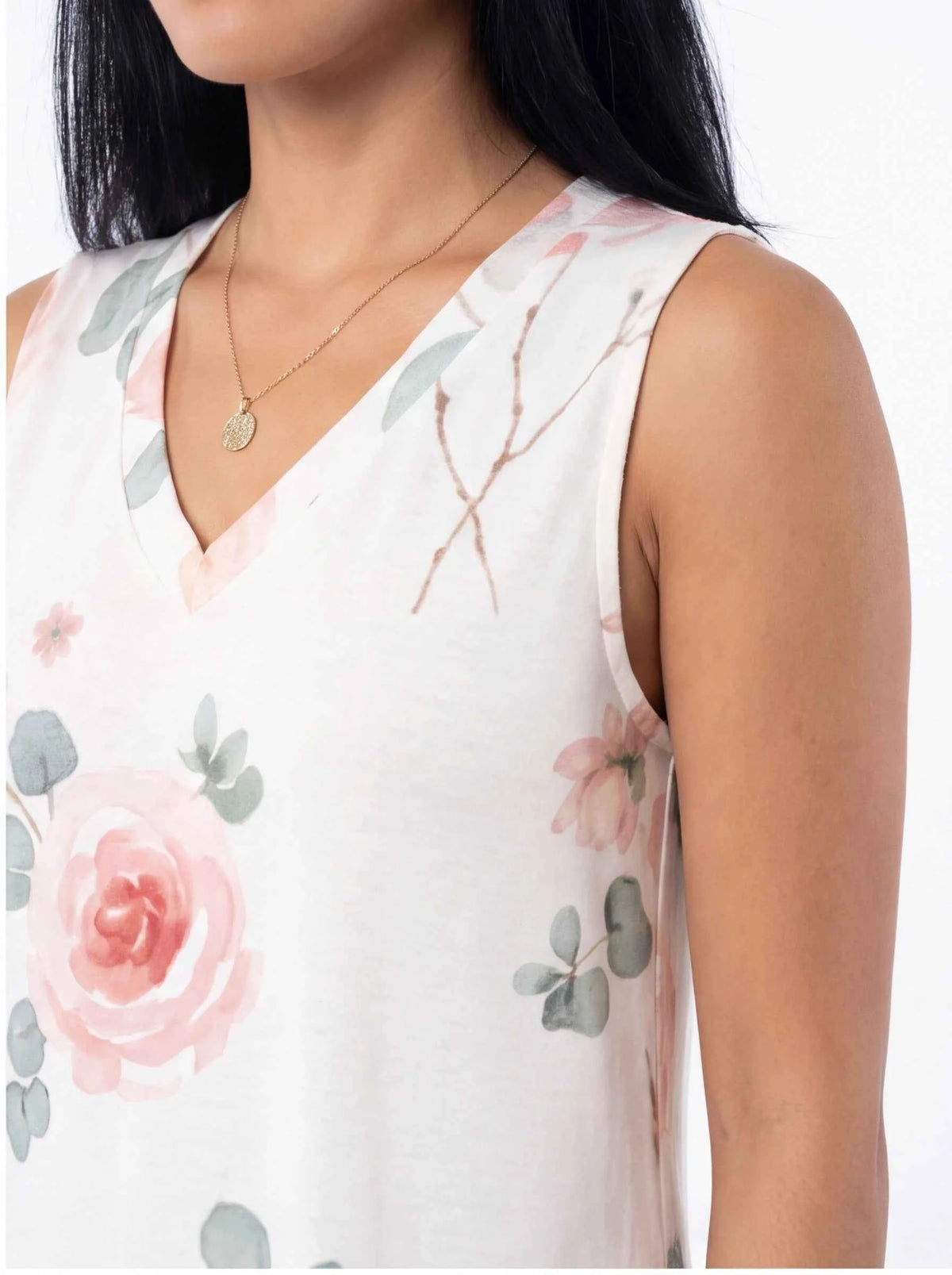 White sleeveless V-neck dress with pink rose and green leaf floral print