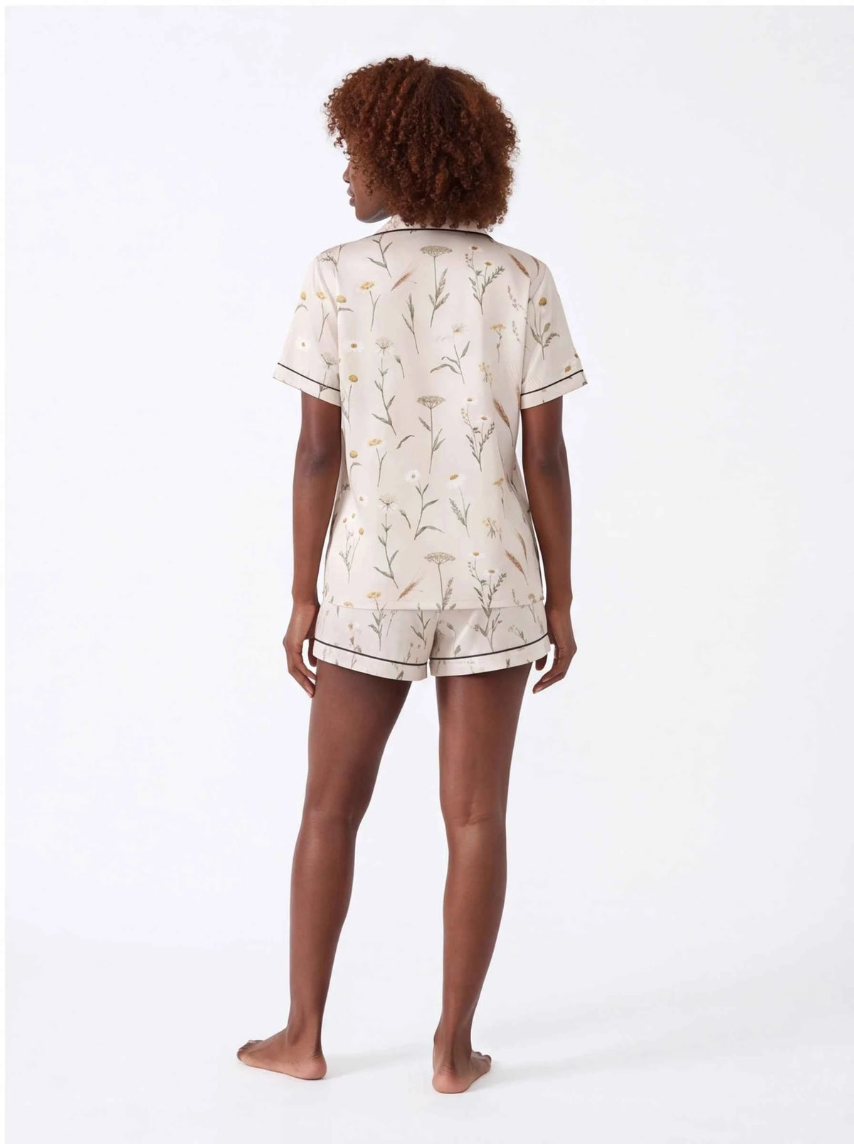 Back view: cream botanical satin pajama set with short-sleeve shirt and matching shorts
