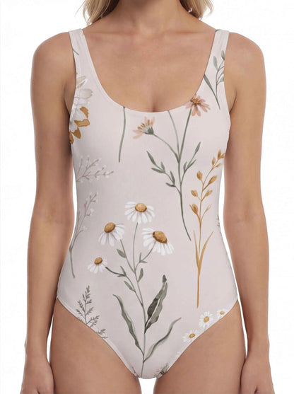 Close-up floral one-piece swimsuit with light base, scoop neck, and detailed print