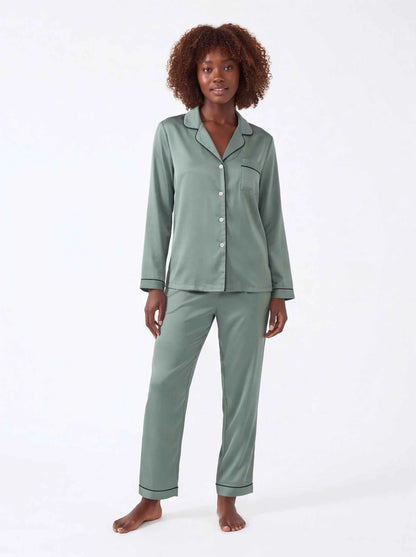 Sage green satin pajama set with button-up shirt and tapered trousers