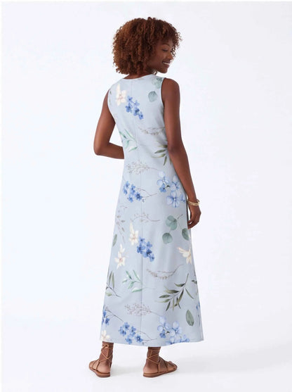 White sleeveless V-neck maxi dress with blue floral and green leaf print, side view