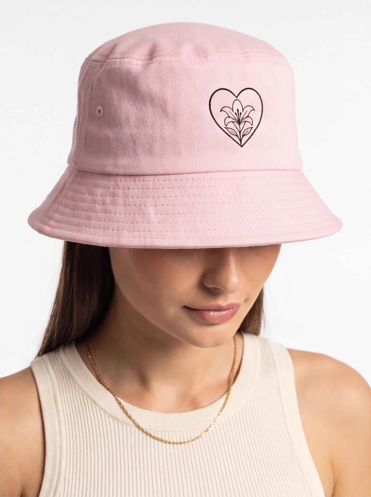 Blush pink bucket hat with heart ribbon embroidery on front