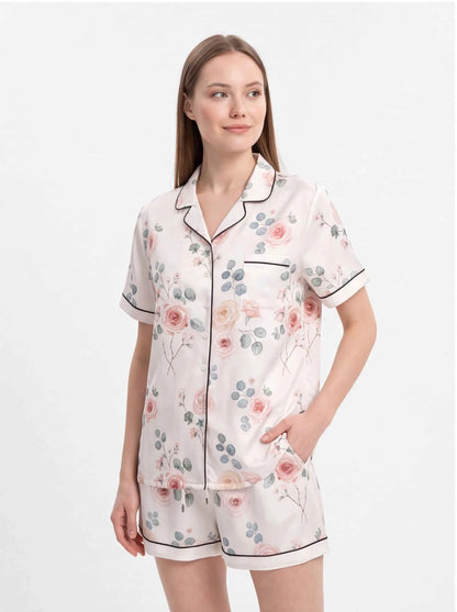 Blush floral satin pajama set with short-sleeve button shirt and matching shorts