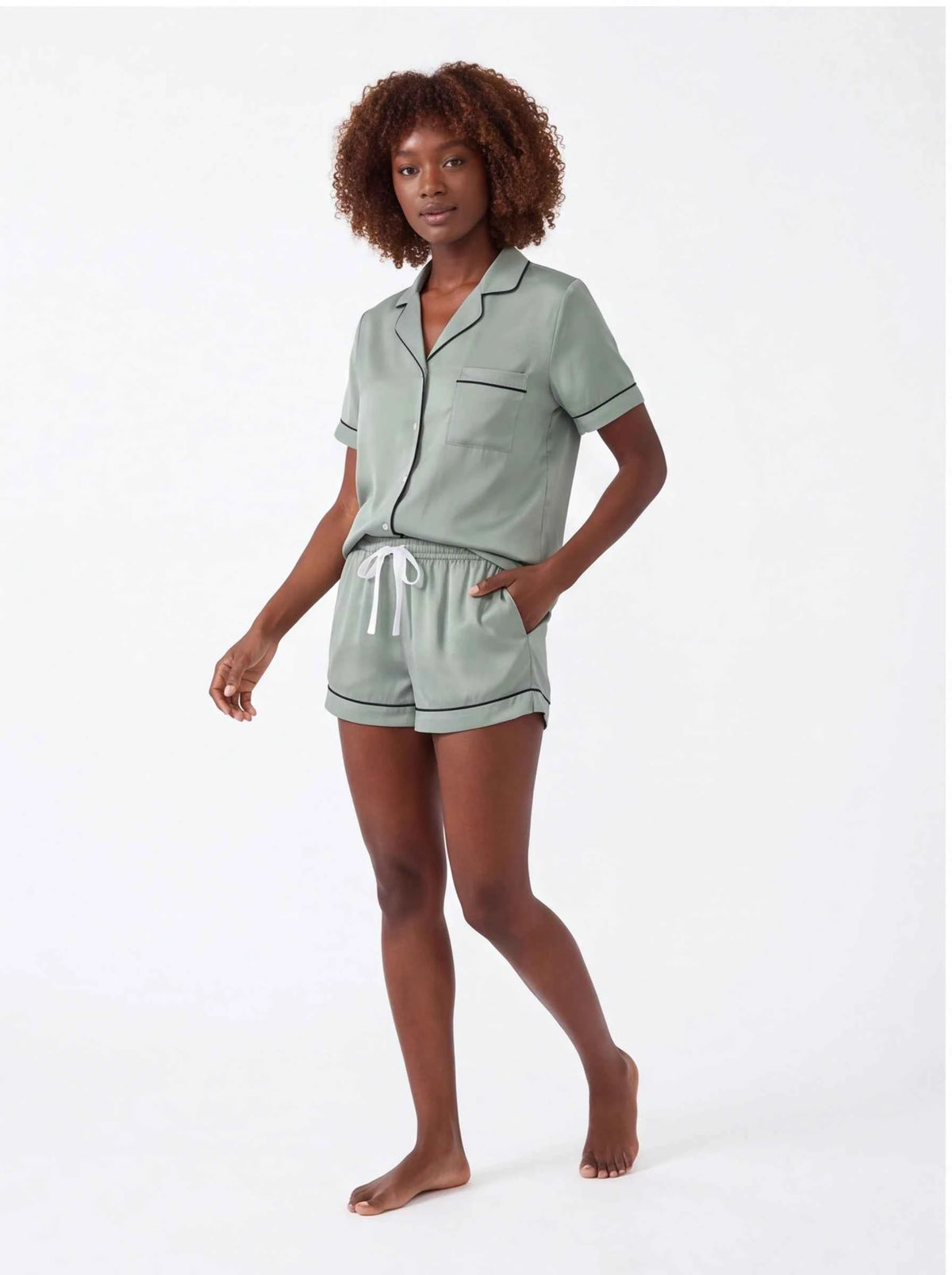 Sage green satin short pajama set with collar, buttons, and tie-waist shorts