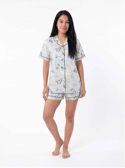 Light blue floral satin pajama set with short-sleeve button shirt and matching shorts
