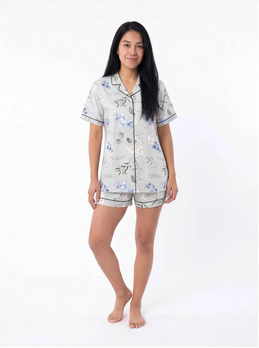 Light blue floral satin pajama set with short-sleeve button shirt and matching shorts