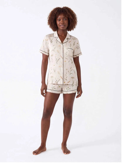Ivory botanical satin pajama set with short-sleeve button shirt and matching shorts
