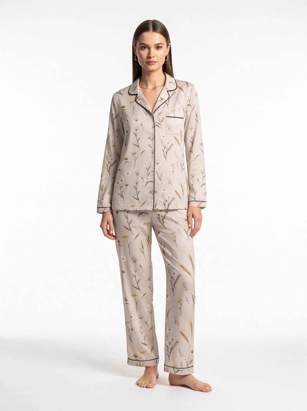 Women's satin lounge pajama set with button-front top and matching floral trousers, cream
