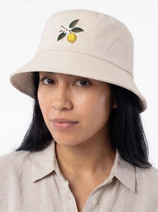 Beige bucket hat with lemon blossom embroidery and side grommets