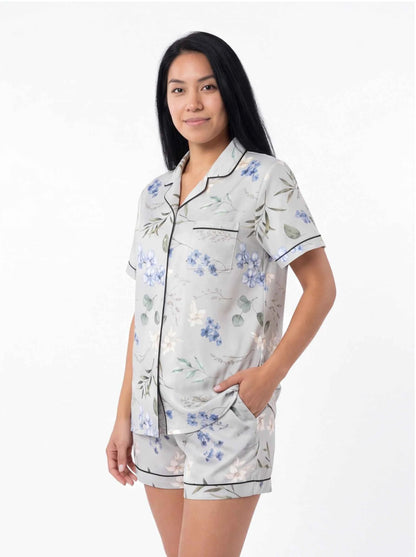 Light blue floral satin pajama set with collared short-sleeve shirt and matching shorts