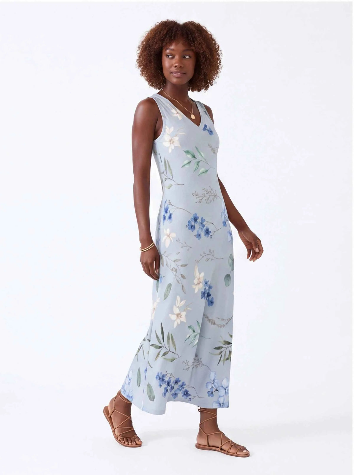 White sleeveless V-neck maxi dress with blue and green floral print, full length