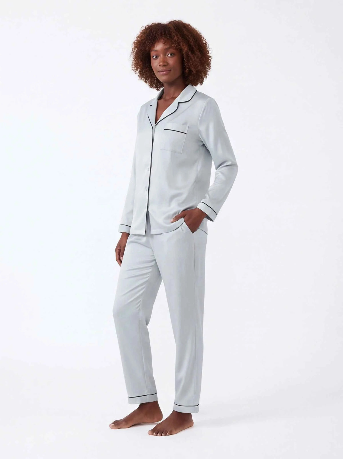 Light blue satin pajama set with button-up shirt and tapered trousers