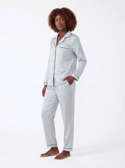 Light blue satin pajama set with button-up shirt and tapered trousers