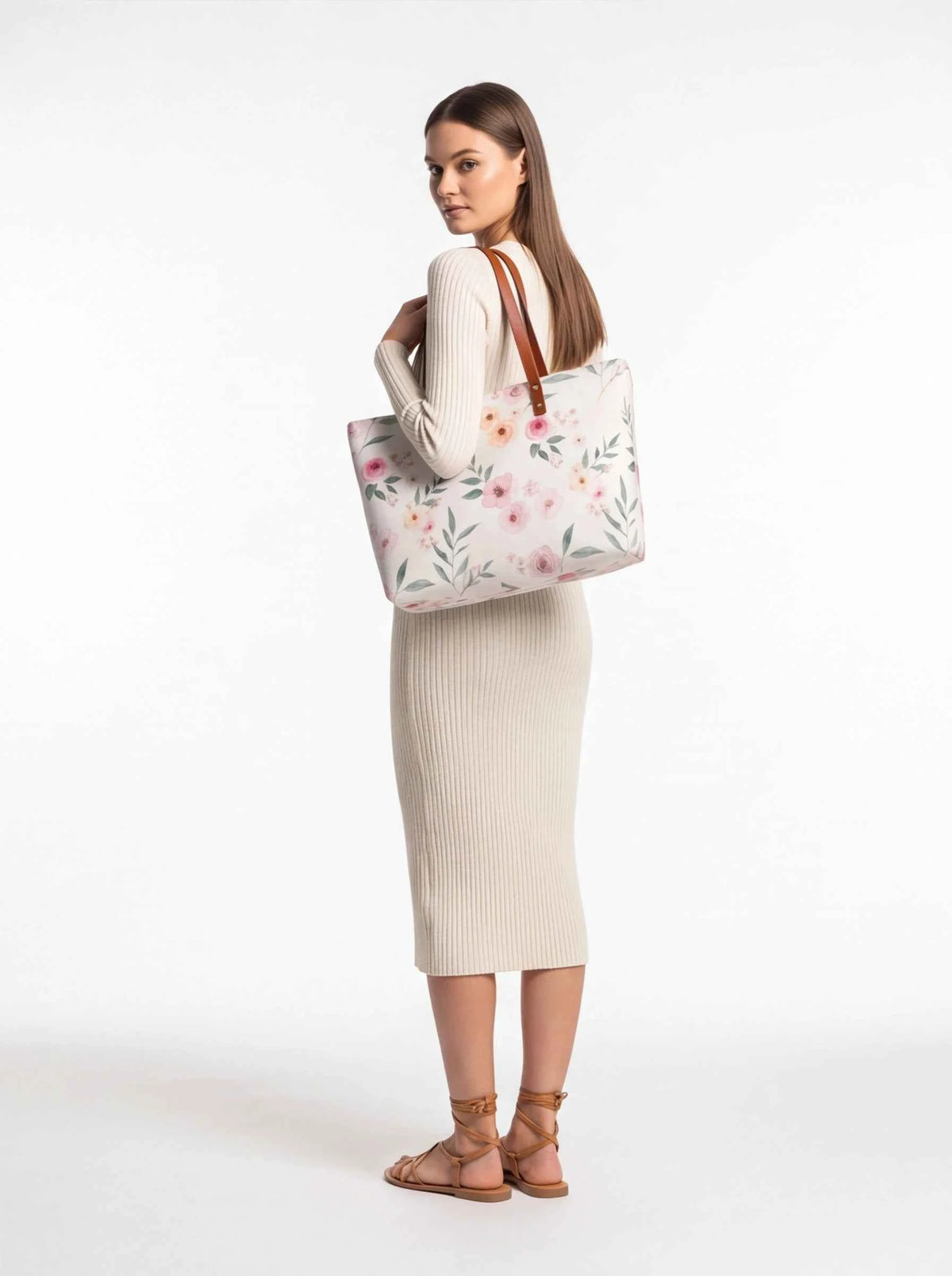 White floral tote bag side view with brown handles and pink flower print