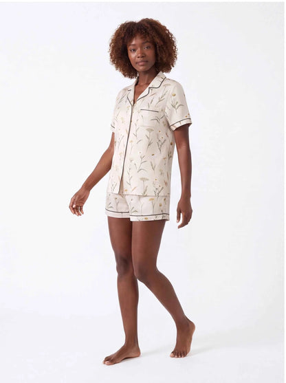 Cream botanical satin pajama set with collared short-sleeve shirt and matching shorts