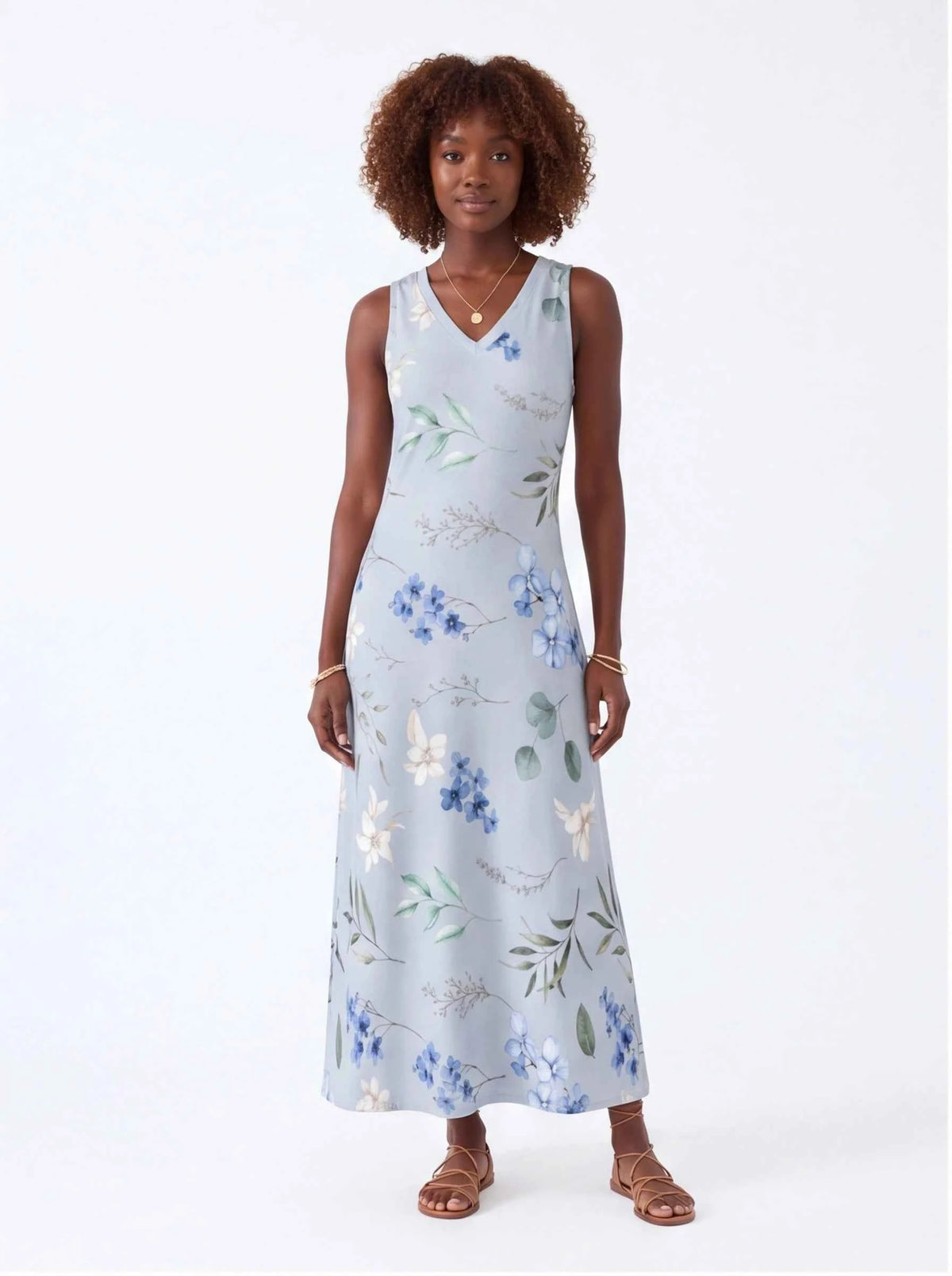 White sleeveless V-neck maxi dress with blue and green floral print