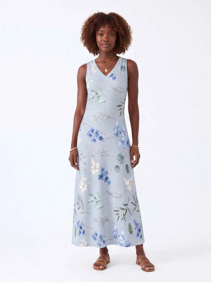 White sleeveless V-neck maxi dress with blue and green floral print
