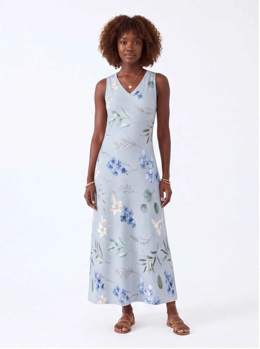 White sleeveless V-neck maxi dress with blue and green floral print